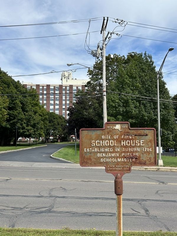 Site of First School House Marker Looking at Schwartz Towers image. Click for full size.