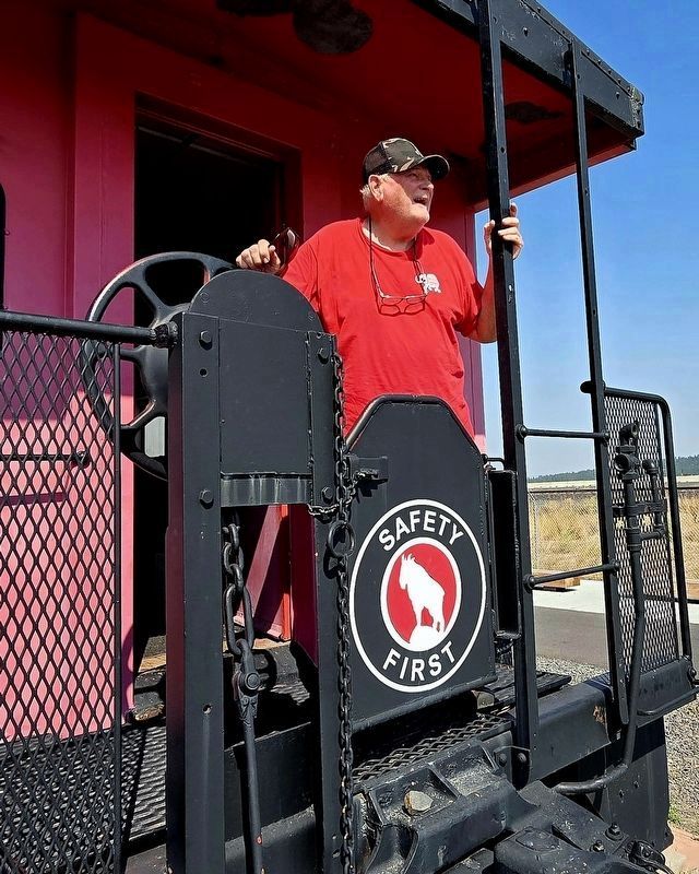 Museum president Tom Heckler in caboose behind James J Hill - "The Empire Builder" Marker. Click for full size. Museum president Tom Heckler in caboose behind James J Hill - "The Empire Builder" Marker image. Click for full size.