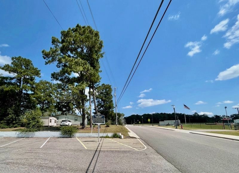 View of marker, in parking lot, looking east on Henderson Street.. Click for full size. View of marker, in parking lot, looking east on Henderson Street. image. Click for full size.