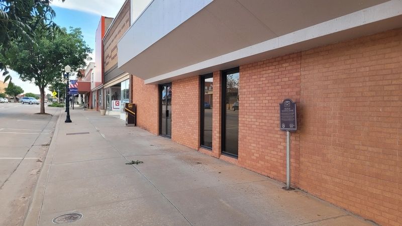 The view of the marker along the sidewalk. Click for full size. The view of the marker along the sidewalk image. Click for full size.