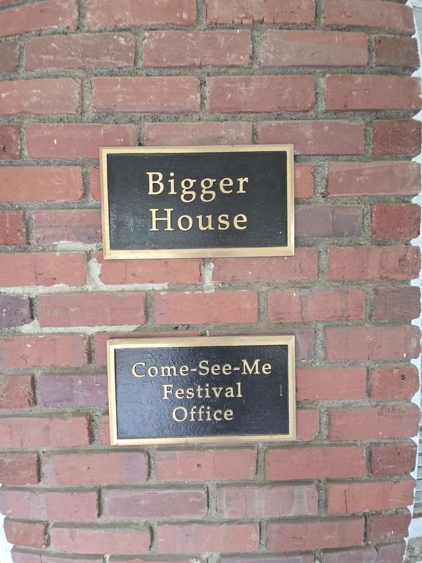 Bigger House and Come-See-Me Festival House plaques on the front porch image. Click for full size.