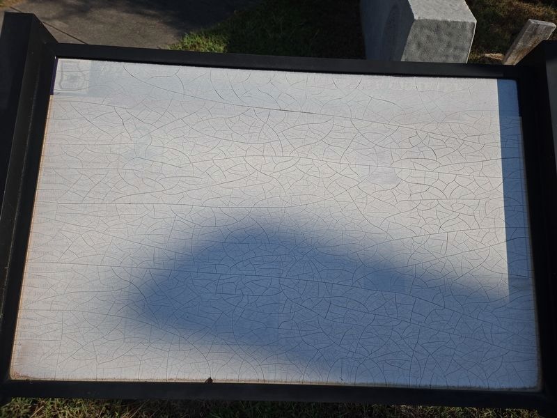 Marker severely faded and cracked from sun damage image. Click for full size.