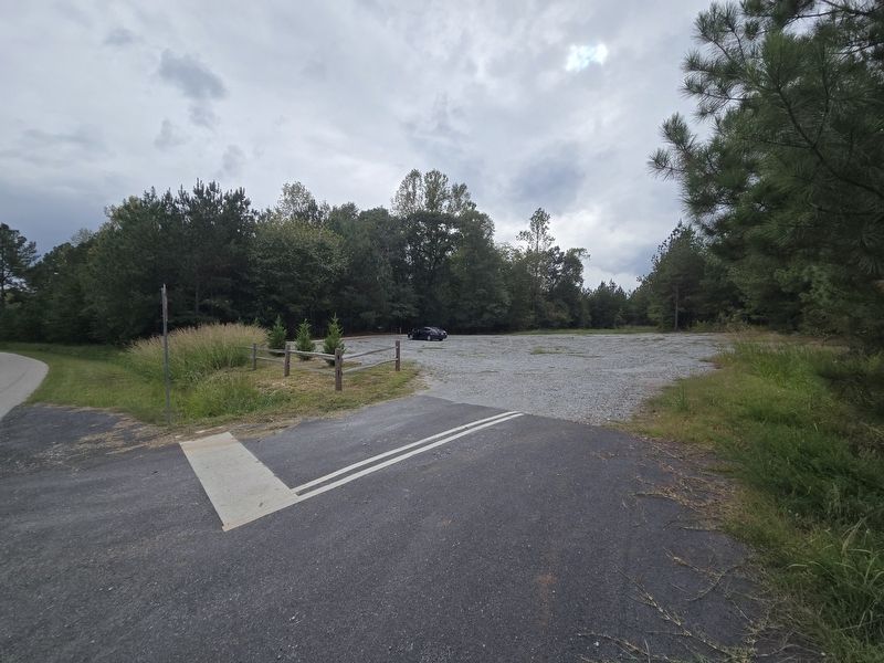 Gravel parking lot off State Road S-11-584. Follow the paved trail to the marker image. Click for full size.
