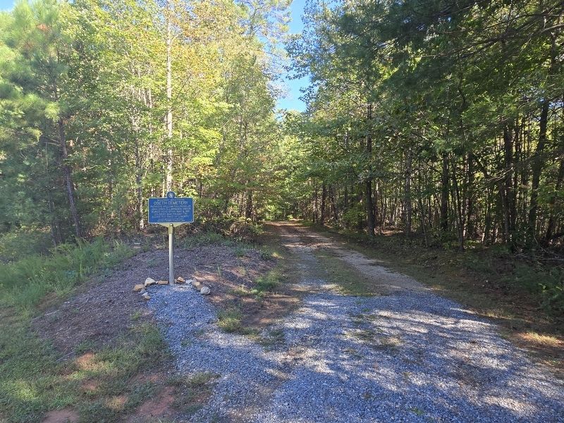 The marker is located at Obeth cemetery, which is accessible by an unmarked dirt road leading south image. Click for full size.