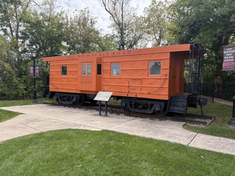 01839 Milwaukee Road caboose and marker image. Click for full size.