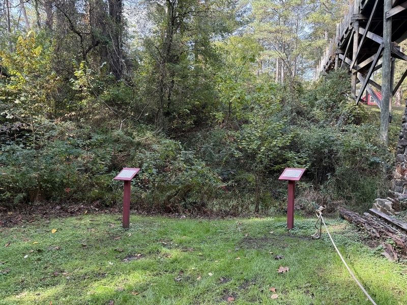 A couple markers in front of the former location of the water wheel. Click for full size. A couple markers in front of the former location of the water wheel image. Click for full size.