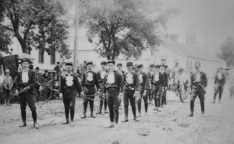 Marker detail: Volunteer firemen march in parade image. Click for full size.