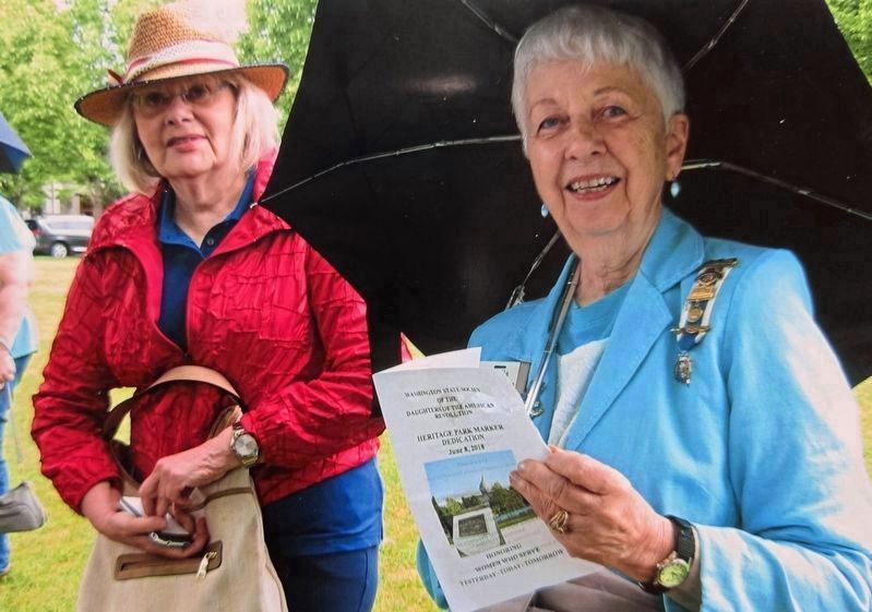 Participants with a dedication brochure. Click for full size. Participants with a dedication brochure image. Click for full size.
