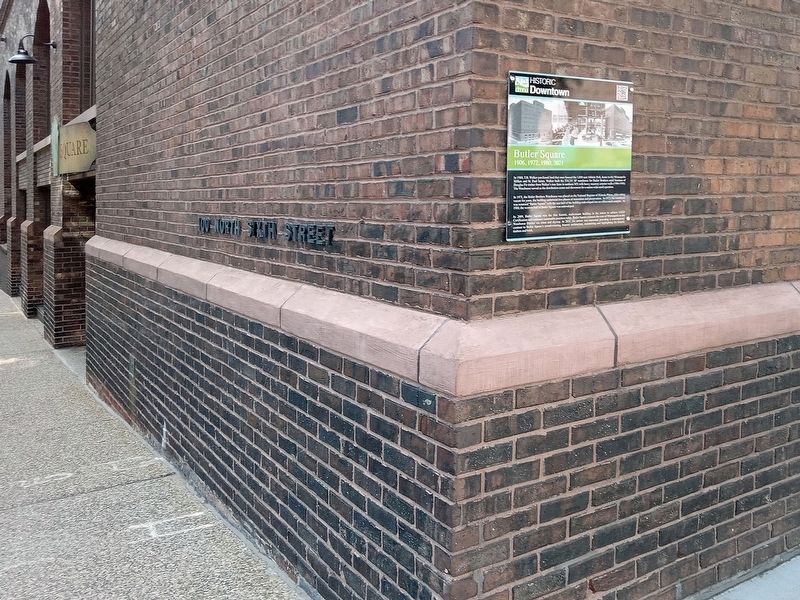 Butler Square Marker at the south corner of the building image. Click for full size.