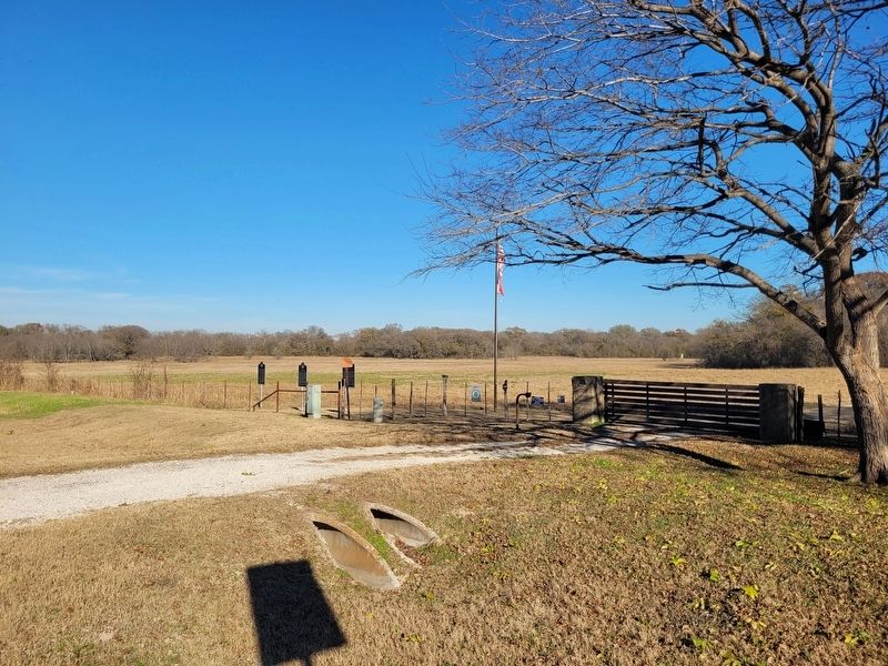 The view of the markers at the entrance to the Pecan Springs Ranch image. Click for full size.
