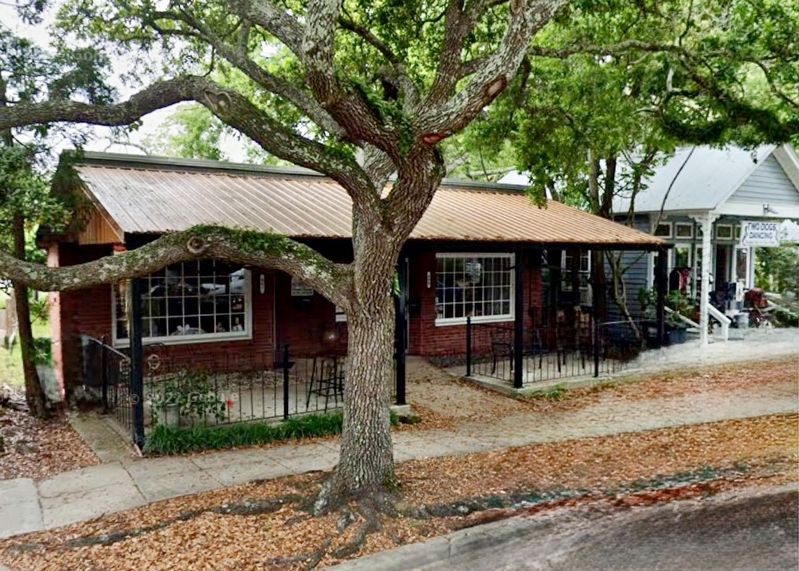 The Bertuccini House & Barbershop Marker behind tree.. Click for full size. The Bertuccini House & Barbershop Marker behind tree. image. Click for full size.