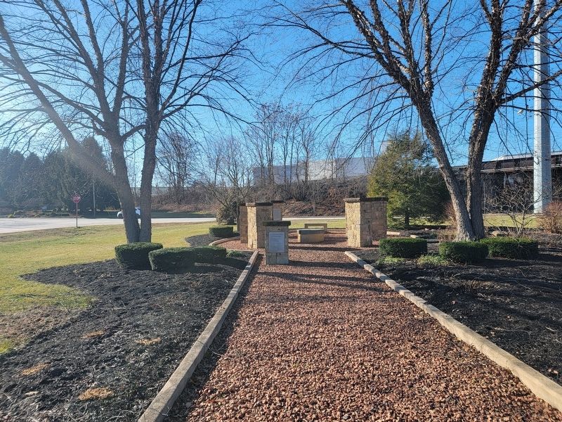View of the group of markers, looking northwest, with the pond behind image. Click for full size.