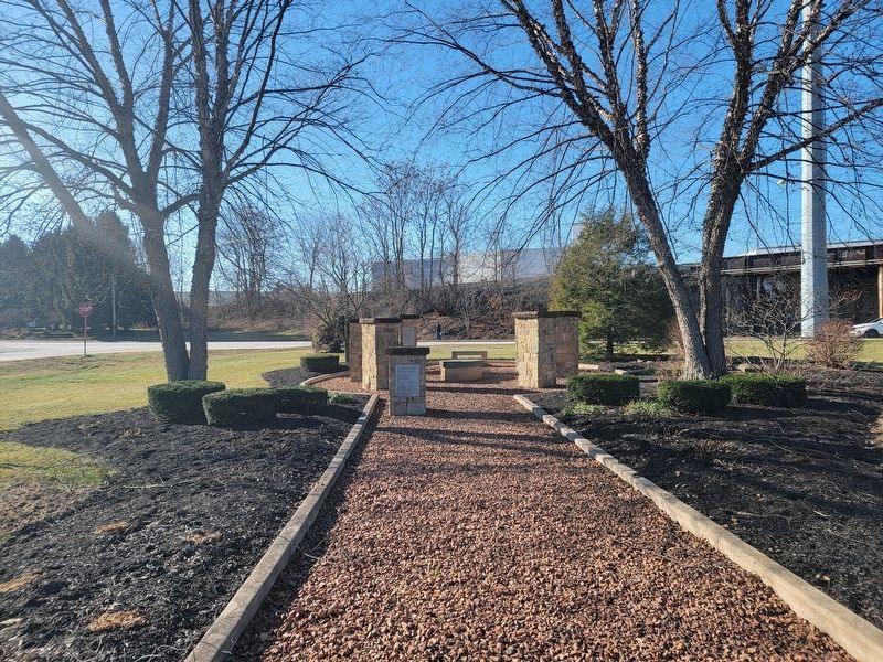 View of the group of markers, looking northwest, with the pond behind image. Click for full size.