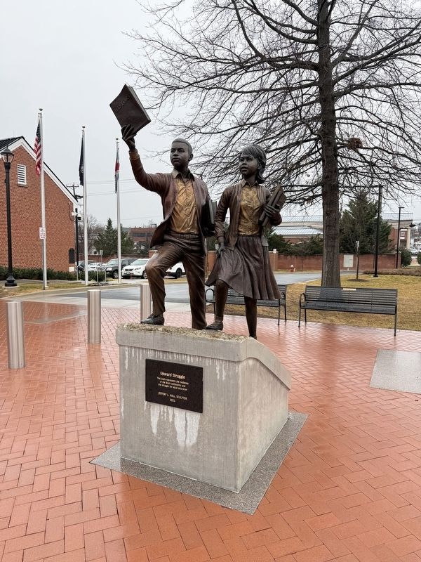 Sculpture near the grand entrance to the school image. Click for full size.