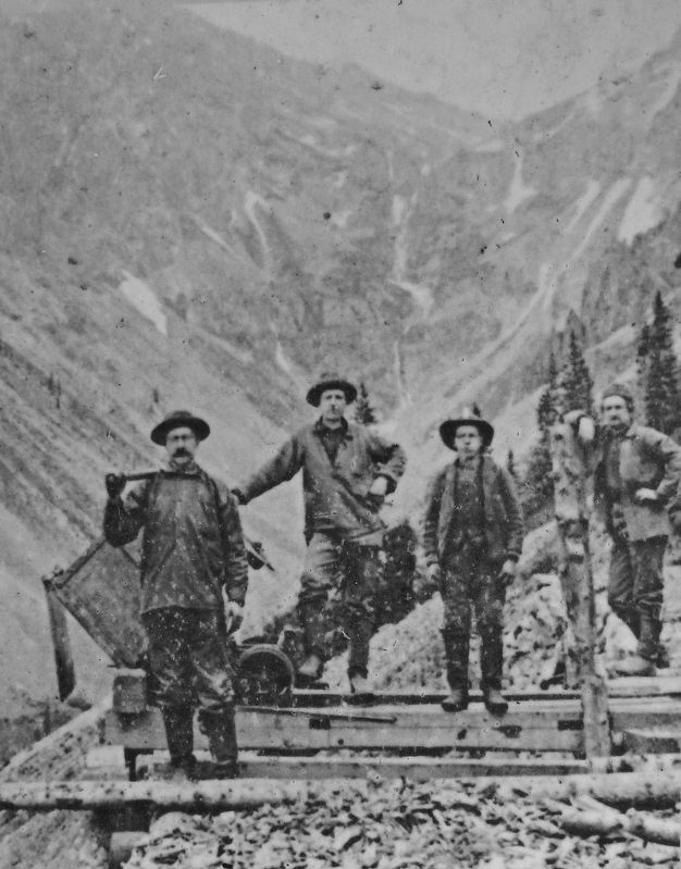 Marker detail: Miners with a swivel end-dump car at the Susquehanna Tunnel north of Silverton, 1880s image. Click for full size.