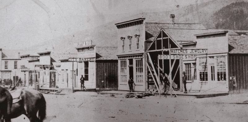 Marker detail: False-front buildings in the process of construction in 1877 image. Click for full size.