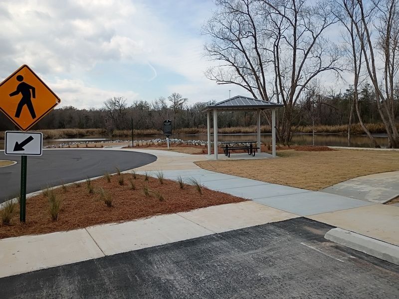 VIew of marker at a distance with shelter area. image. Click for full size.