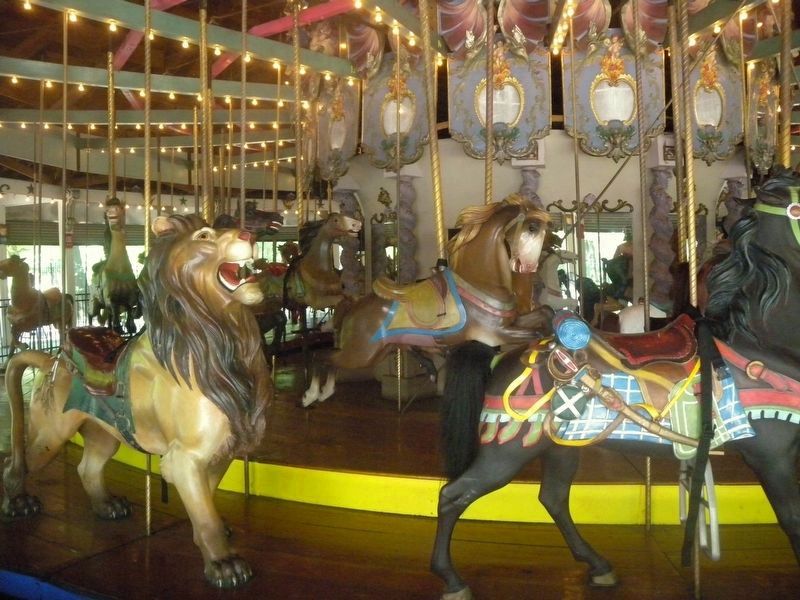 Looking west at carousel on a sunny midday. image. Click for more information.