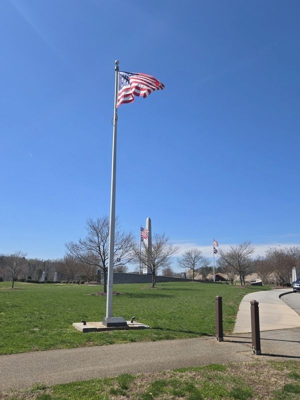 National Flag and Marker display looking towards the center obelisk at Carolina Field of Honor image. Click for full size.
