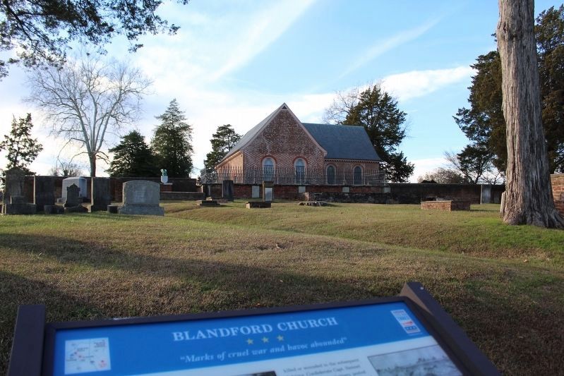 Blandford Church beyond the marker image. Click for full size.