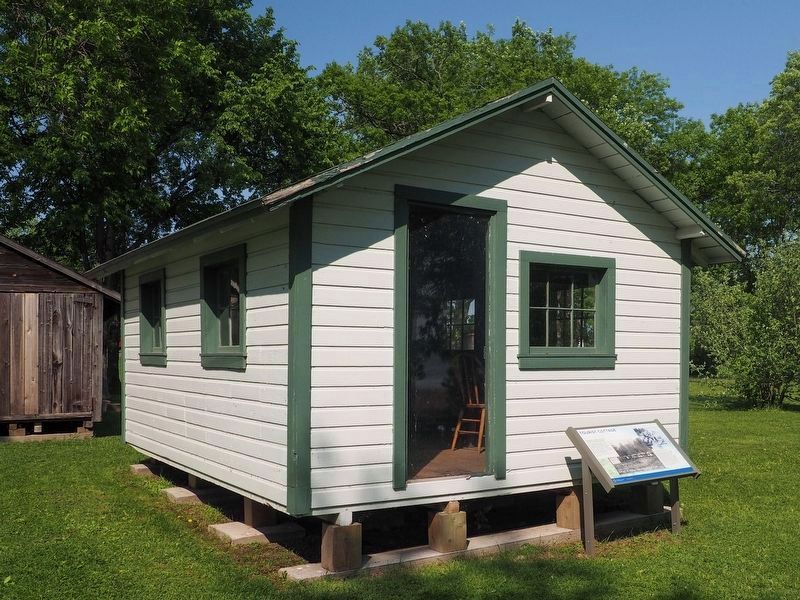 Tourist Cottage and Marker at the Mille Lacs Indian Museum and Trading Post image. Click for full size.