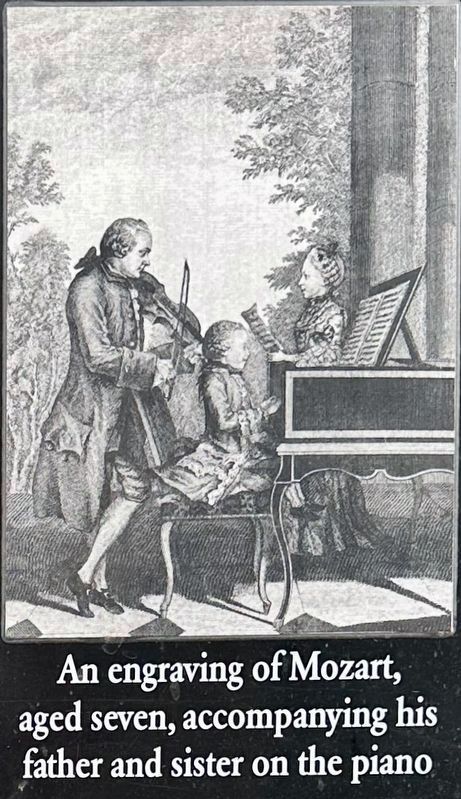 Marker inset illustration: Mozart at the piano, age 7. Click for full size. Marker inset illustration: Mozart at the piano, age 7 image. Click for full size.