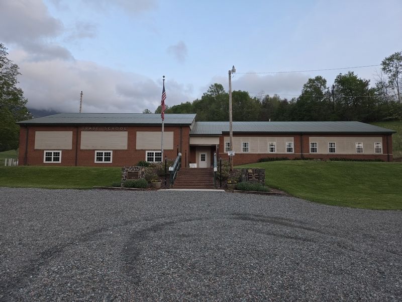 Wide view Trade Elementary School. Indigenous People Marker is left of the steps image. Click for full size.