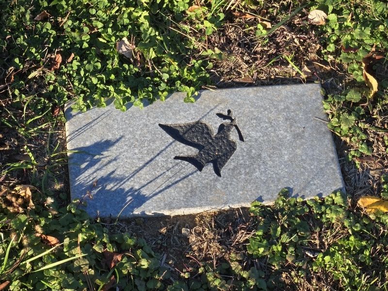 Individual dove marking the burial plot of an unknown person in the African American Cemetery. Click for full size. Individual dove marking the burial plot of an unknown person in the African American Cemetery image. Click for full size.