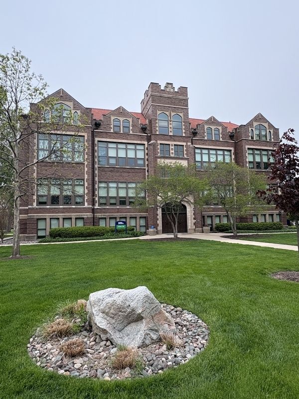 Glacial boulder and Aurora Universitys Eckhart Hall. Click for full size. Glacial boulder and Aurora Universitys Eckhart Hall image. Click for full size.