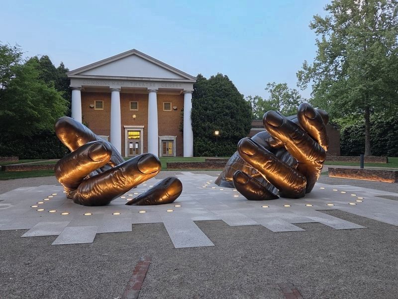With These Hand sculpture next to Cunningham Theatre Center image. Click for full size.
