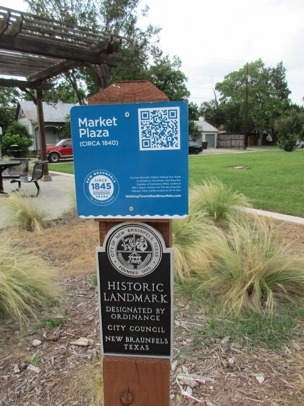 Market Plaza informational sign and New Braunfels Historic Landmark plaque. Click for full size. Market Plaza informational sign and New Braunfels Historic Landmark plaque image. Click for full size.