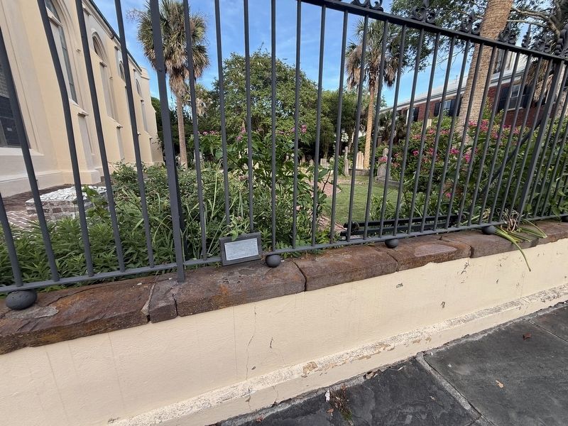 The Unitarian Churchyard Marker along the fencing. The churchyard can be seen in the background. image. Click for full size.