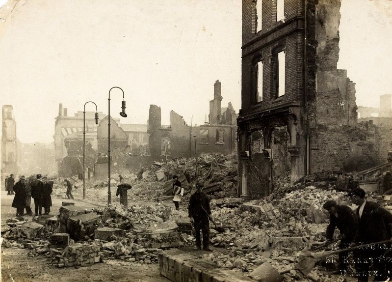 Workers clearing rubble on St Patrick's Street in Cork after the fires image. Click for full size.