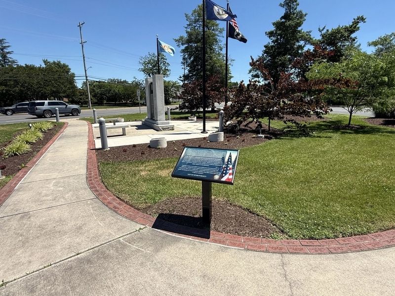The Kiwanis Park Veterans Memorial Monument Marker with the memorial monument in the background image. Click for full size.