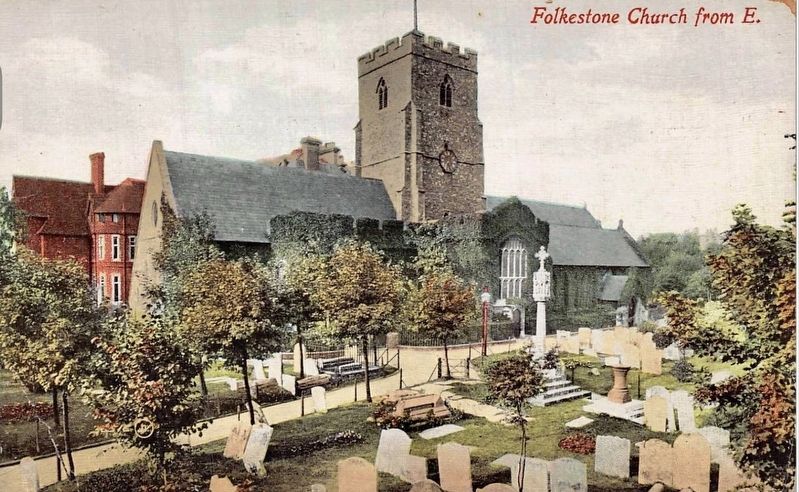 View of church and churchyard, with the Town Cross image. Click for full size.
