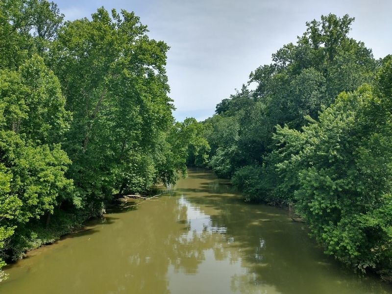 Piers for the suspension bridge can still be seen along both banks of Fourteen Mile Creek. image. Click for full size.