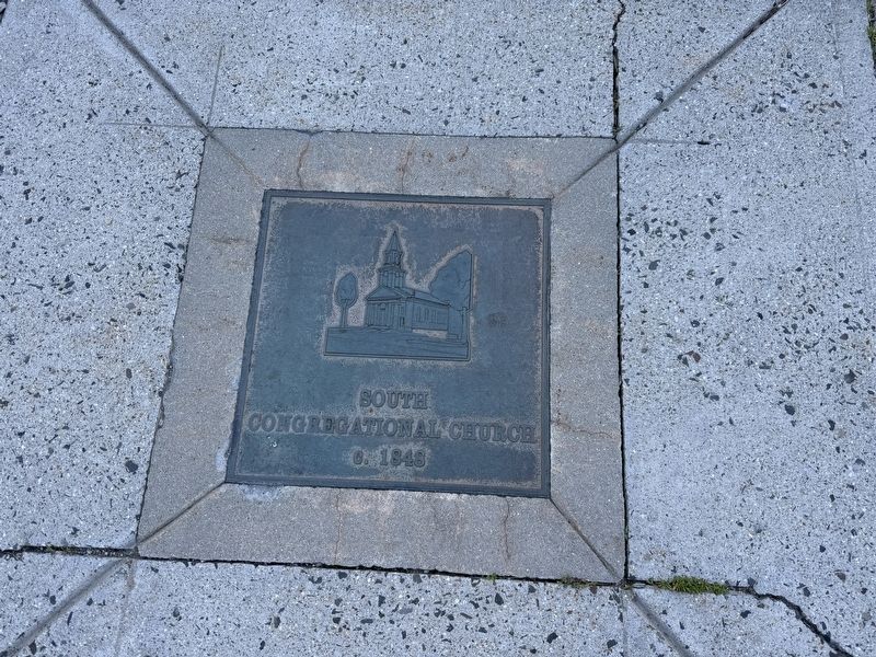 Nearby plaque embedded in the sidewalk image. Click for full size.