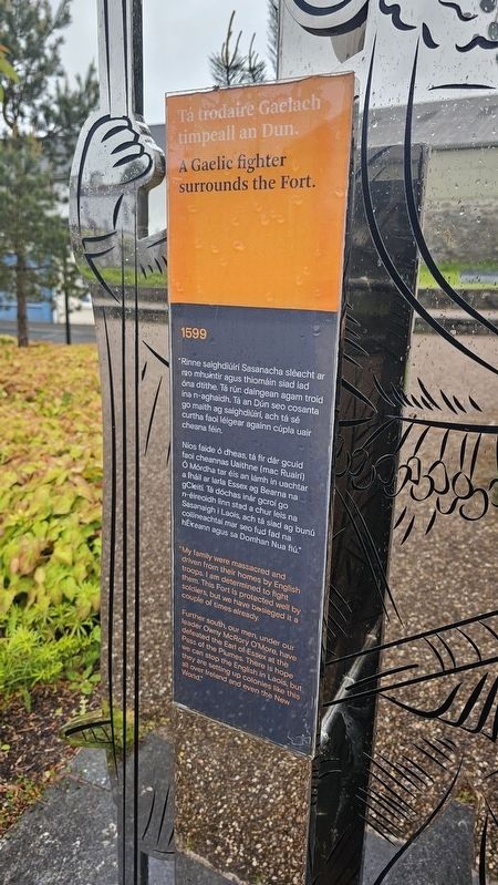 Tá trodaire Gaelach timpeall an Dun / A Gaelic Fighter Surrounds the Fort Marker. Click for full size. Tá trodaire Gaelach timpeall an Dun / A Gaelic Fighter Surrounds the Fort Marker image. Click for full size.
