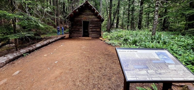 View of marker and cabin. image. Click for full size.
