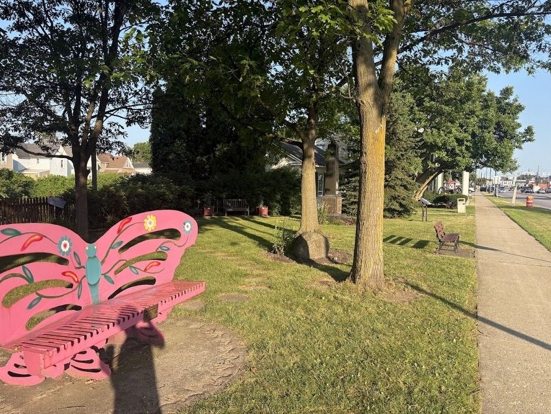 Memorials and artwork near the Batavia Peace Garden image. Click for full size.