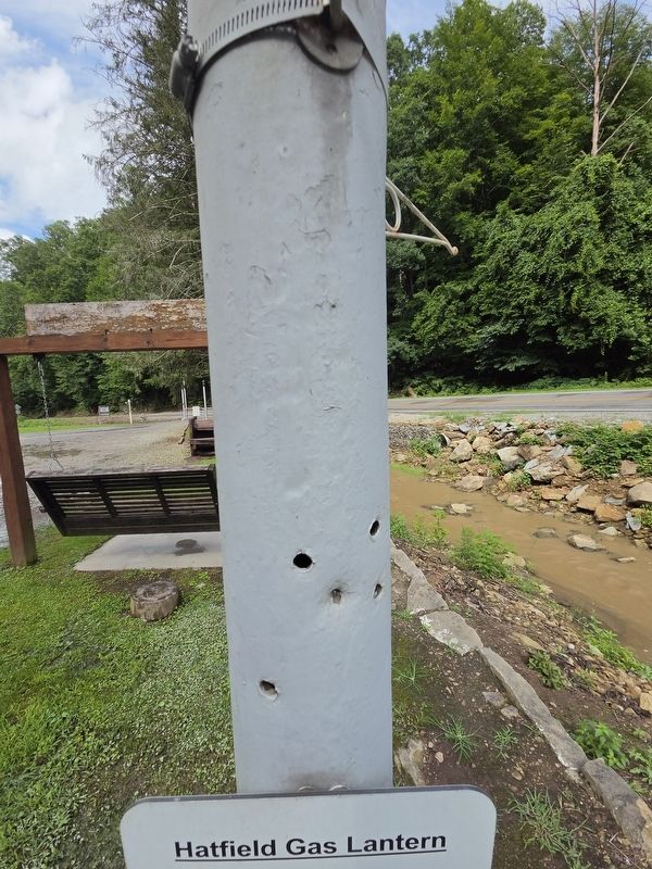 Rumored bullet holes reportedly fired into the Hatfield Gas Lantern by Devil Anse Hatfield. image. Click for full size.