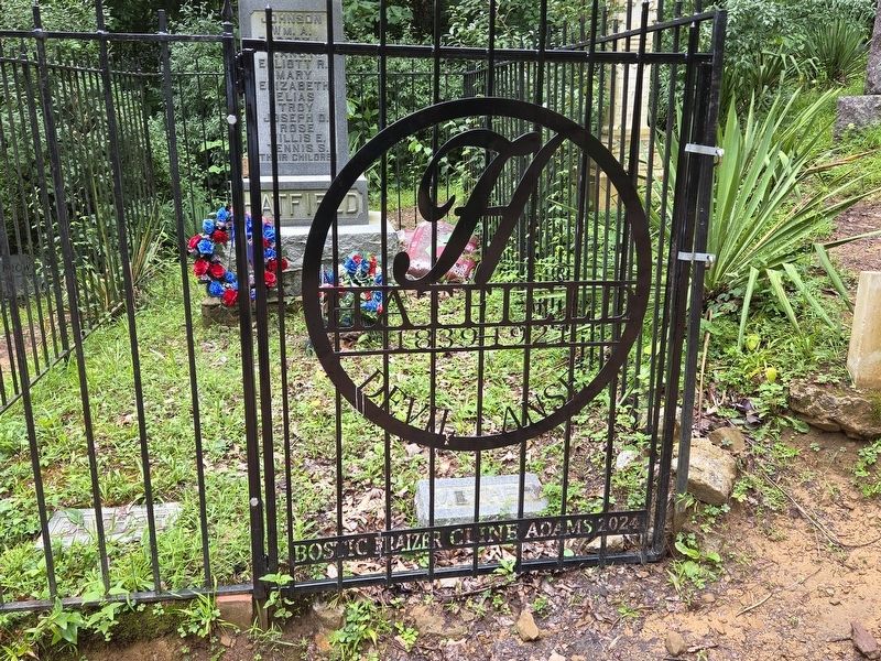 Hatfield Cemetery gate to Devil Anse statue. Click for full size. Hatfield Cemetery gate to Devil Anse statue image. Click for full size.