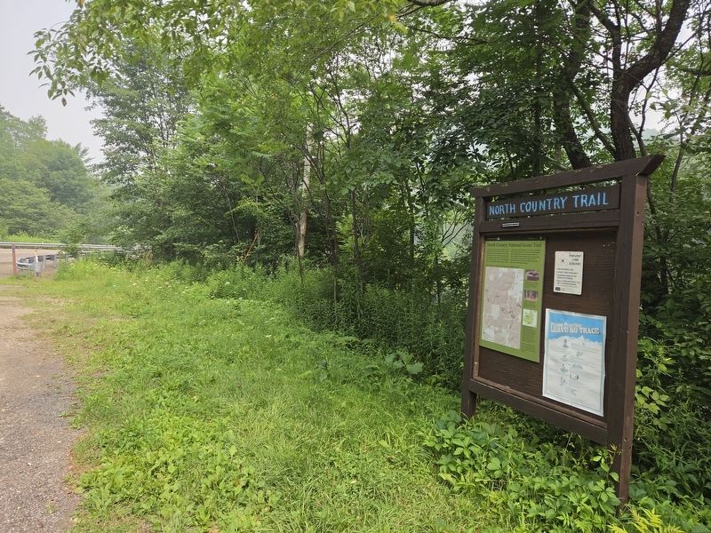 Wide view of North Country National Scenic Trail Marker at travel kiosk. Click for full size. Wide view of North Country National Scenic Trail Marker at travel kiosk image. Click for full size.