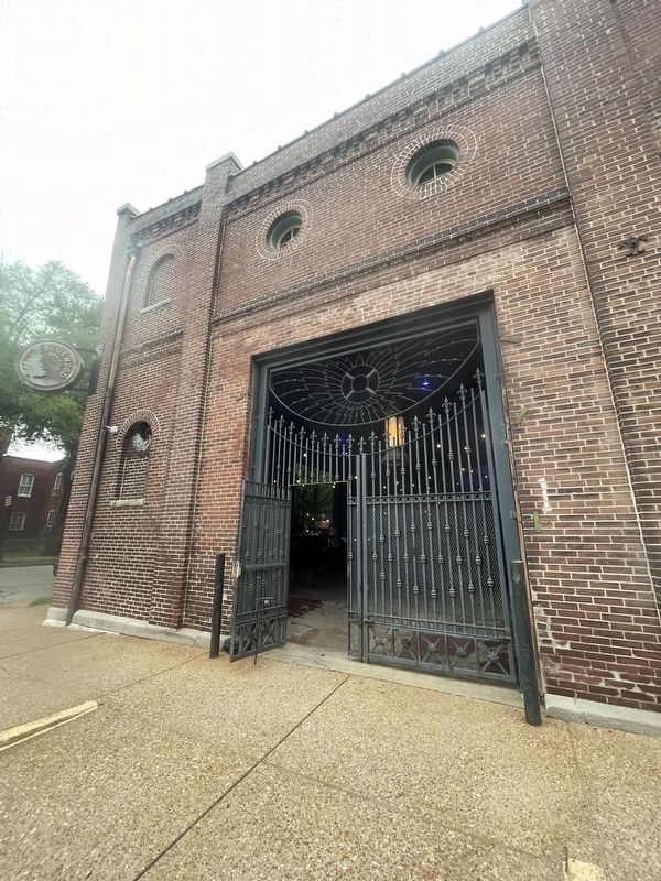 The Wagon House Marker - view of the Great Gate into the Wagon House, now opens to a brewery image. Click for full size.