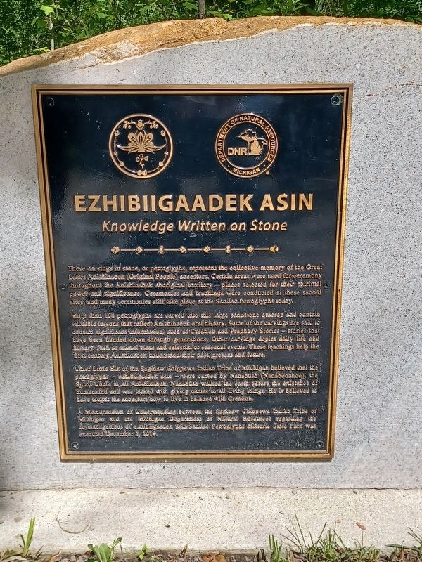 Ezhibiigaadek Asin Marker. Click for full size. Ezhibiigaadek Asin Marker image. Click for full size.