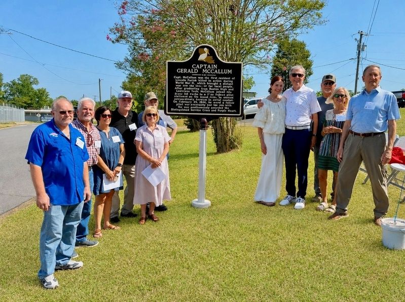 Member of McCallum's family gather around his new marker.. Click for full size. Member of McCallum's family gather around his new marker. image. Click for full size.