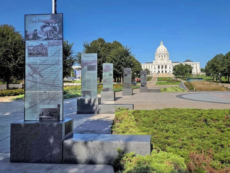 Governor, Warrior, Peacemaker Marker (2nd from end) on the west side of the Minnesota WWII Memorial image. Click for full size.