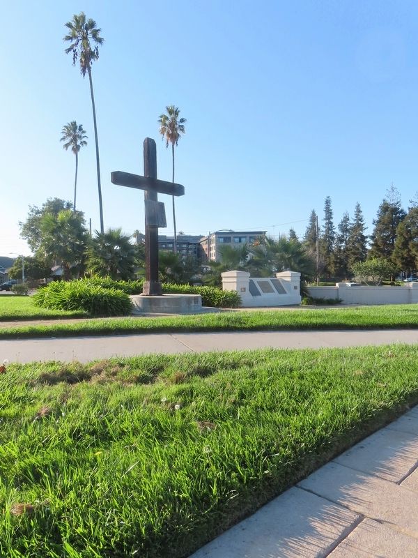 View near marker to the monument with a wooden cross and plaques marking site #3. Click for full size. View near marker to the monument with a wooden cross and plaques marking site #3 image. Click for full size.