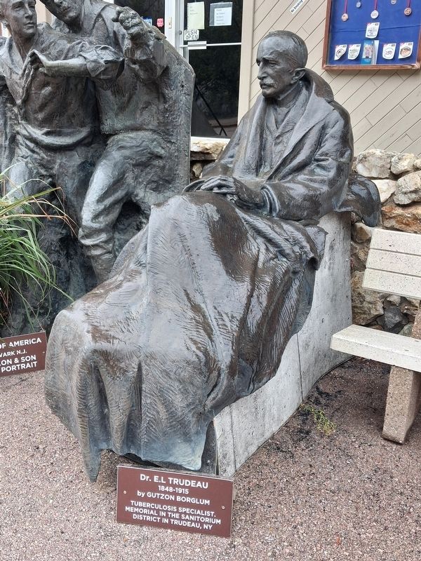 Dr. E. L. Trudeau Statue and Marker. Click for full size. Dr. E. L. Trudeau Statue and Marker image. Click for full size.
